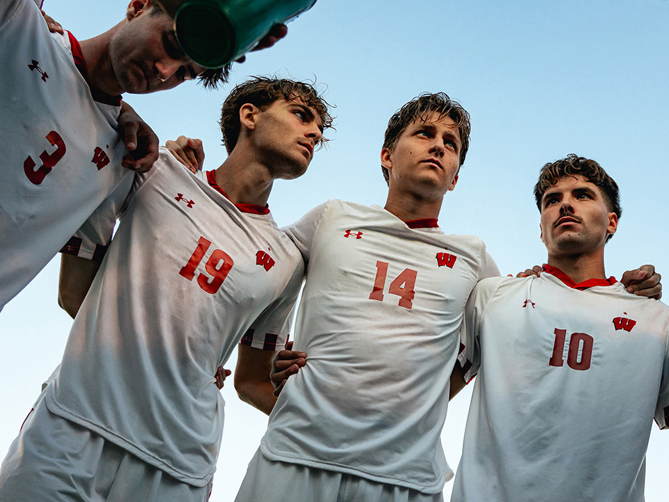 UW Badgers men's soccer team in a huddle